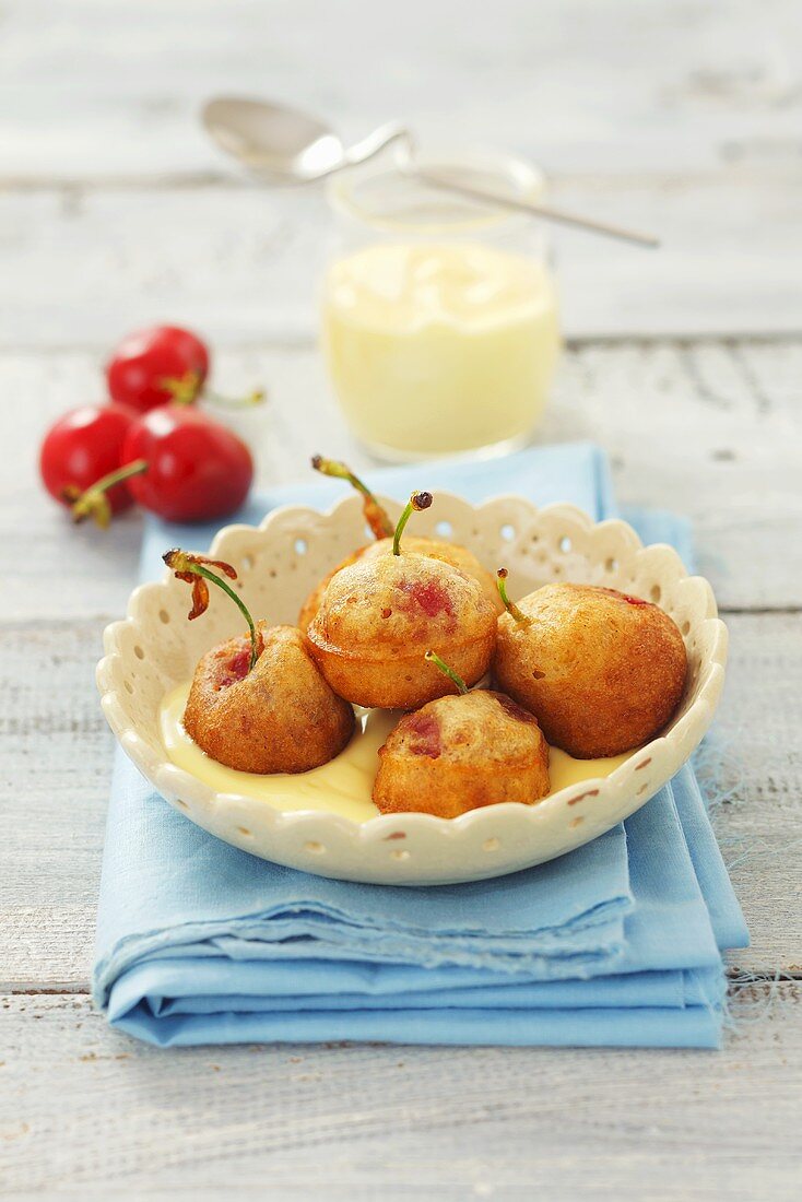 Cherry fritters with custard