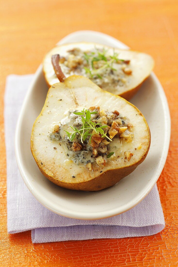 Baked pear stuffed with blue cheese and walnuts