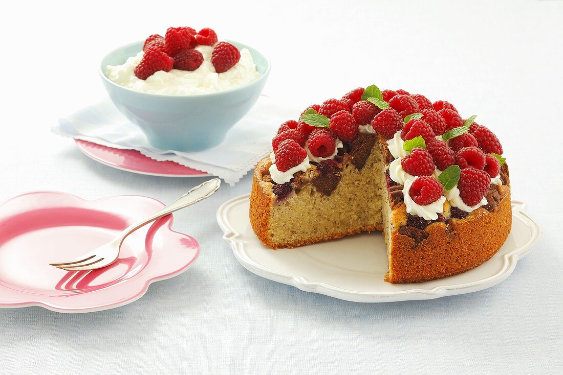 Raspberry cake with chocolate biscuits and cream