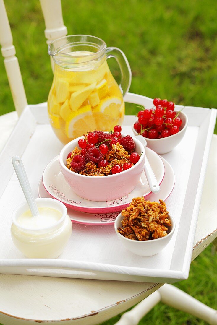 Cereal with raspberries and redcurrants, lemonade