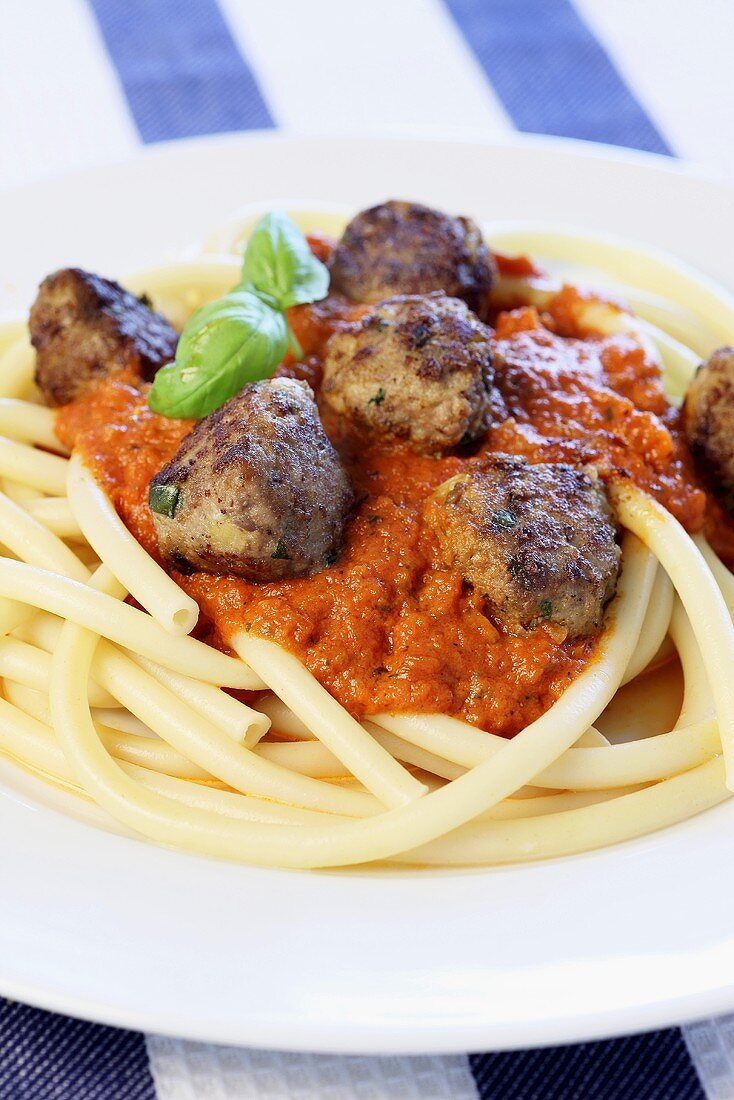 Macaroni with meatballs and tomato sauce