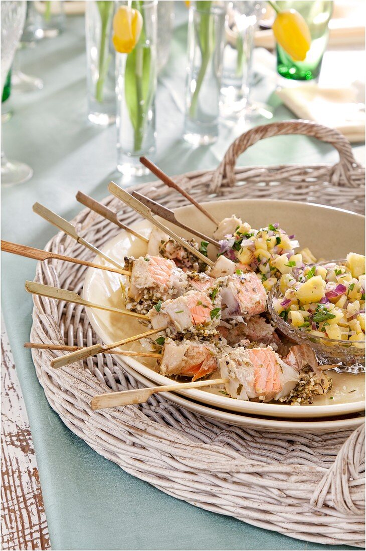 Barbecued salmon and hake kebabs with pineapple salsa