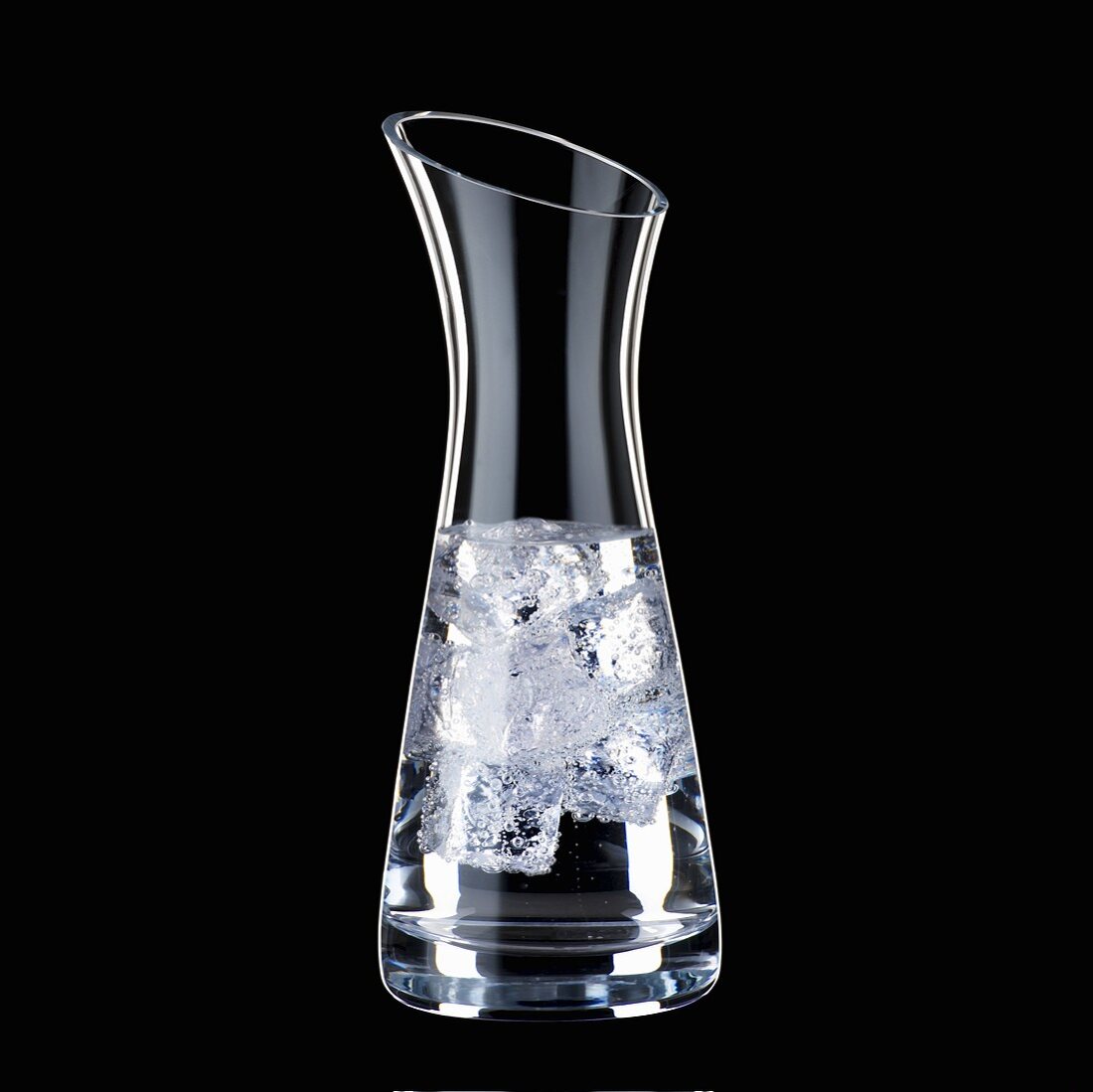 Water with ice cubes in carafe