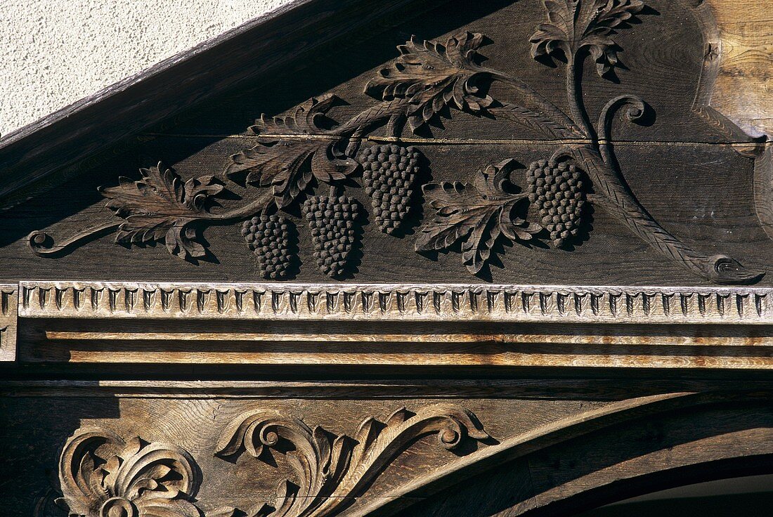 Wood carving of a vine on door arch, Jidvei Castle, Romania