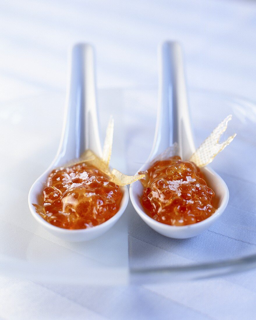 Caramelised salmon caviar on two spoons