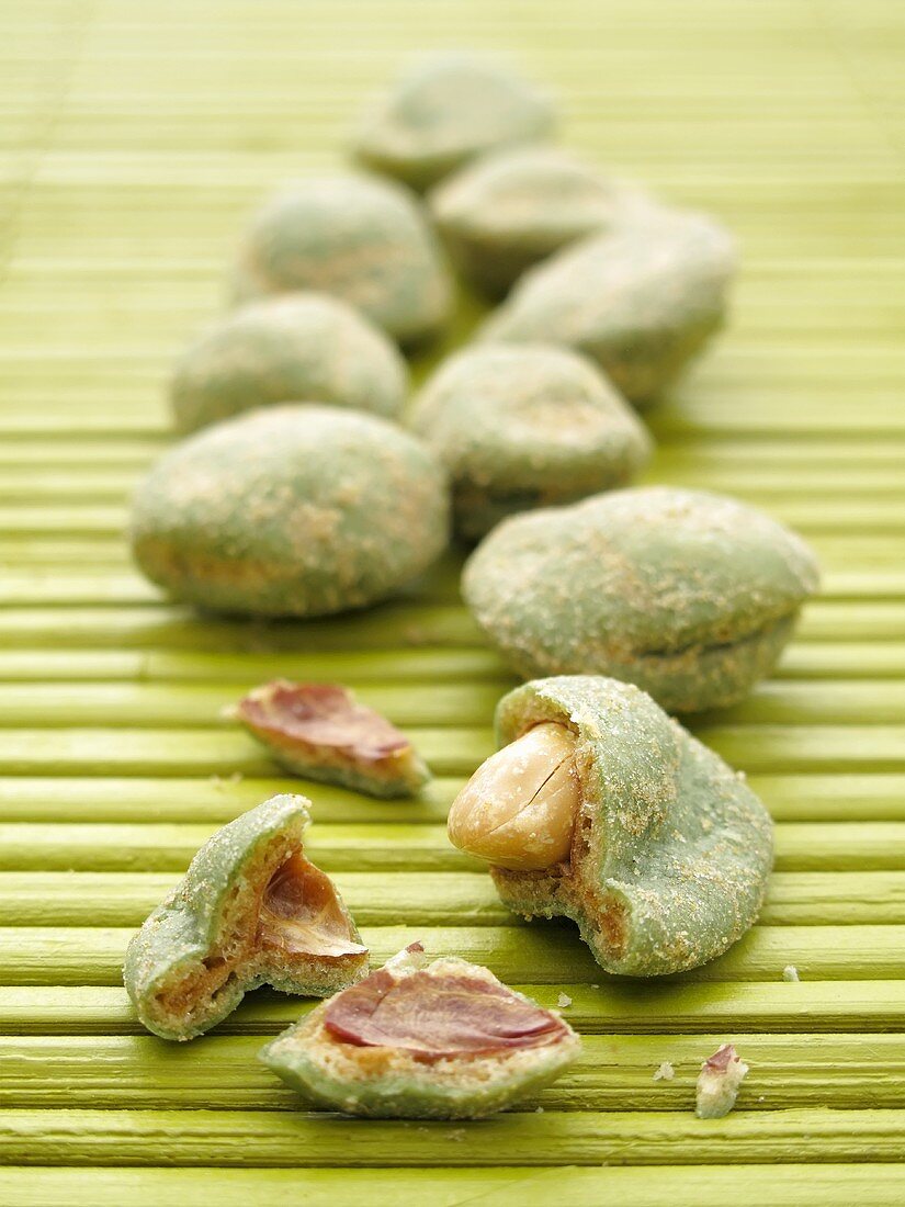 Wasabi peanuts on a bamboo mat