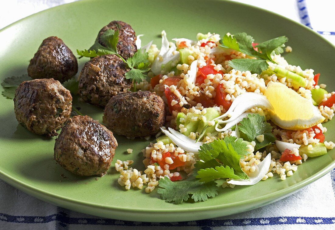 Meat balls with bread salad and coriander