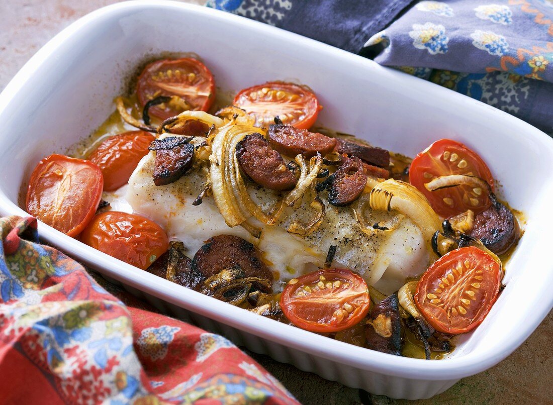 Cod fillet with chorizo, tomatoes and onions