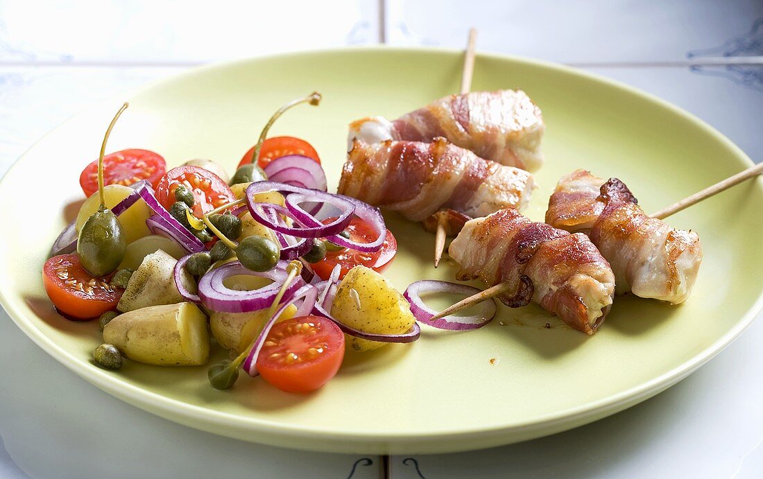 Chicken roulade with bacon and potato and tomato salad