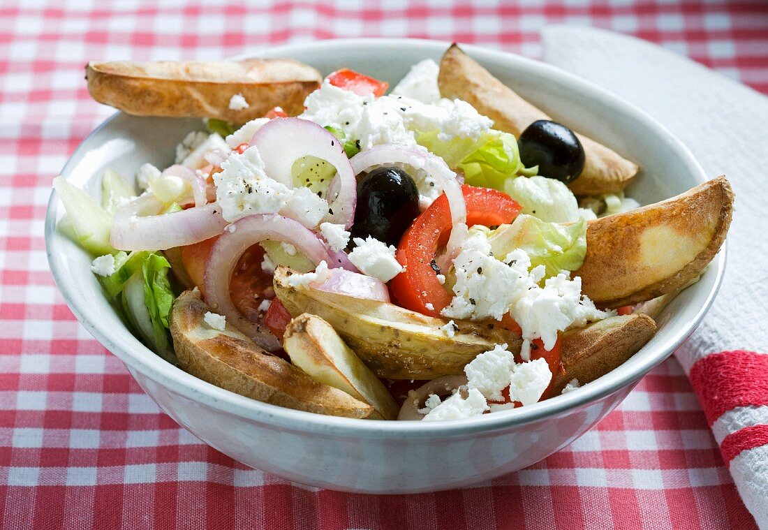Greek salad with potato wedges