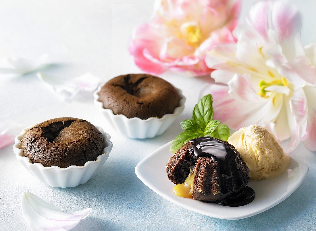 Chocolate cakes with egg liqueur, chocolate sauce and ice cream