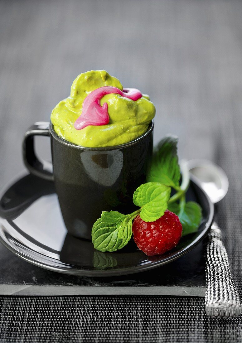 Sweet avocado cream with raspberries