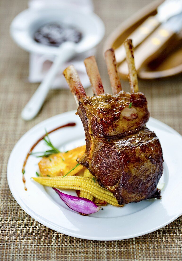 A grilled rack of lamb with vegetables