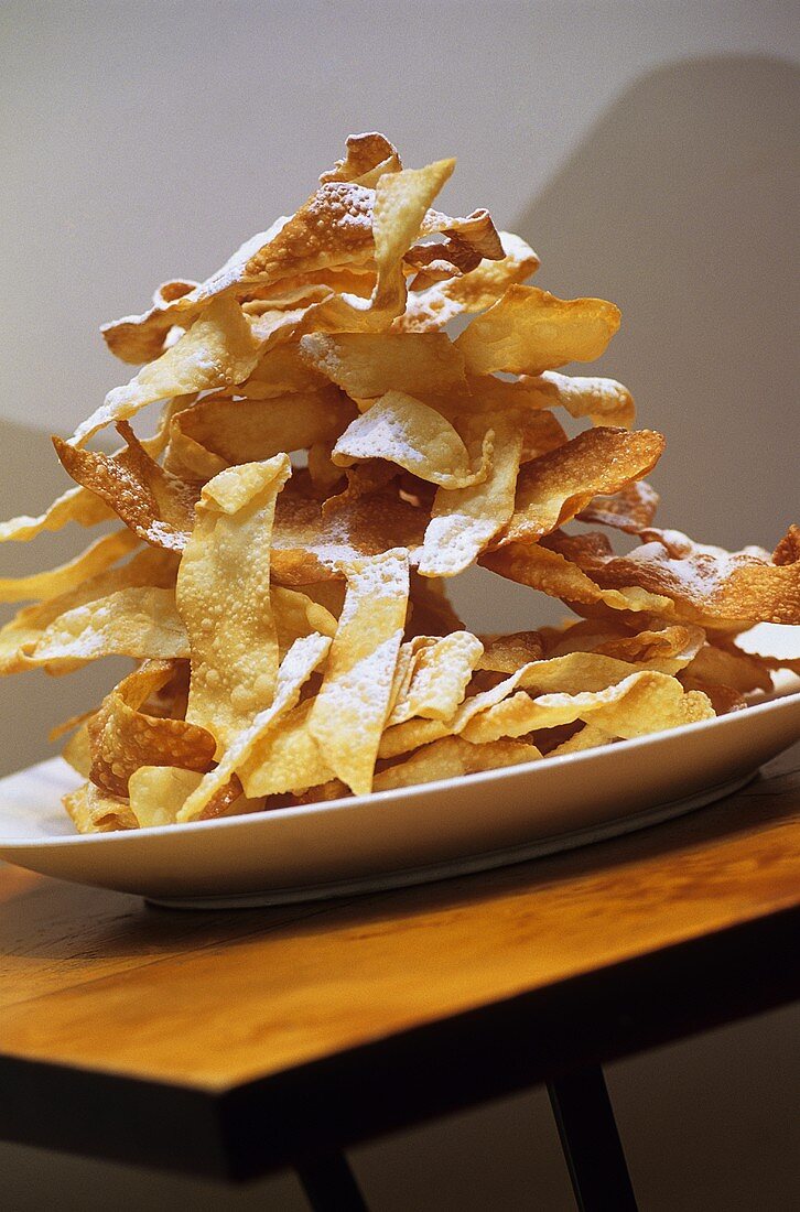 Crostoli (fried pastry with icing sugar, Italy)