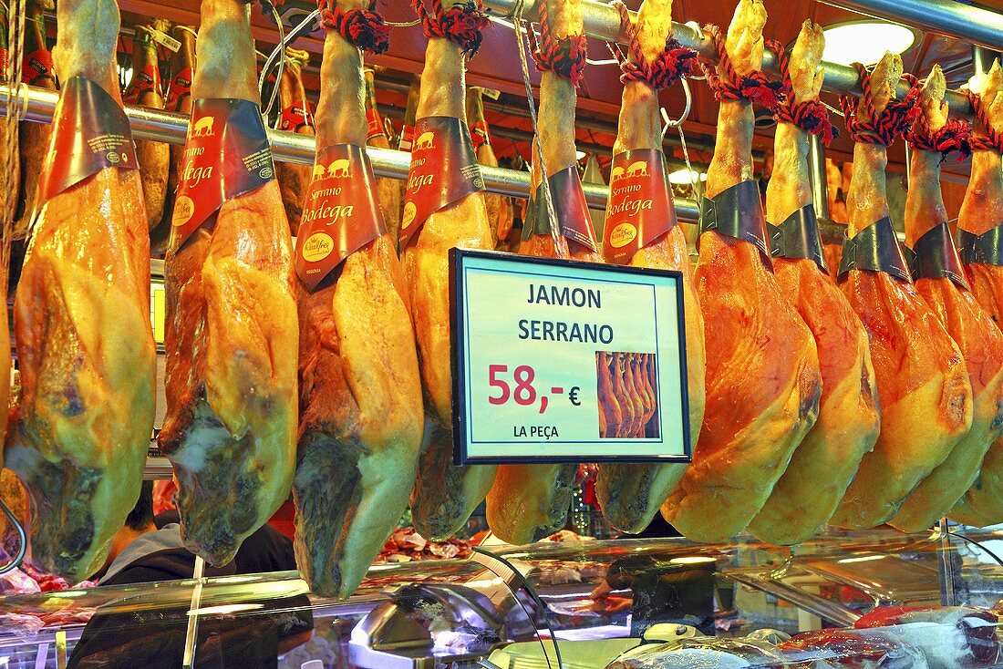 Serrano ham on a market stall (Mercat de St. Josep (Boqueria), Las Ramblas, Barcelona, Spain)