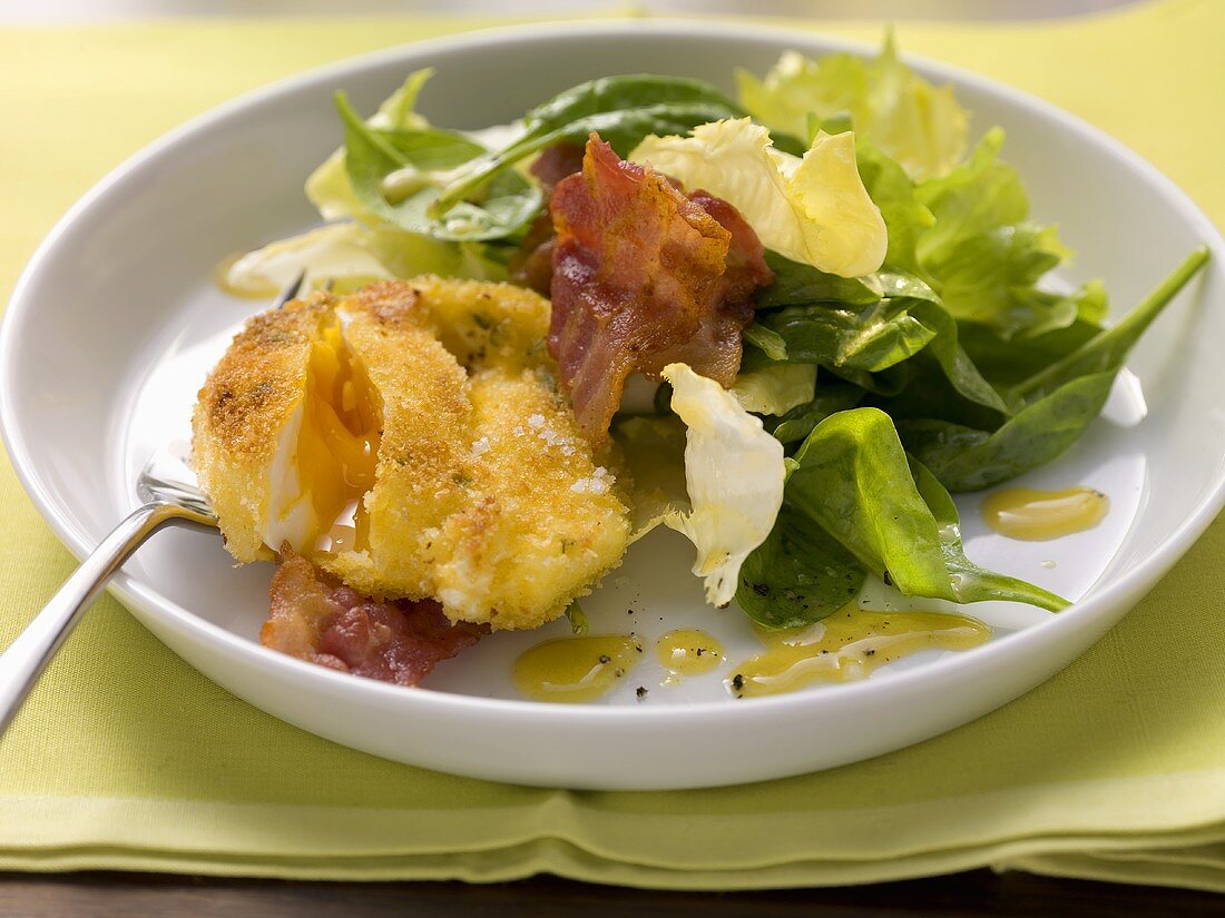 Baked poached egg with a spinach salad