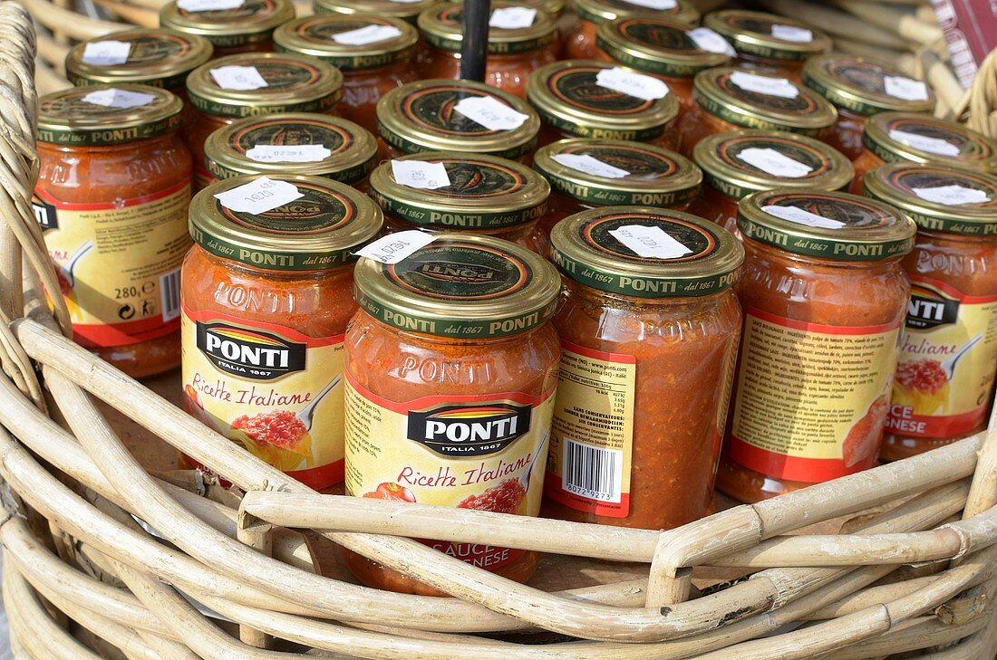 Bolognese sauce in jars at a market