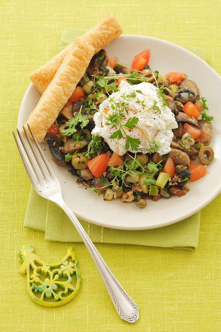 Poached egg on mushroom and olive salad