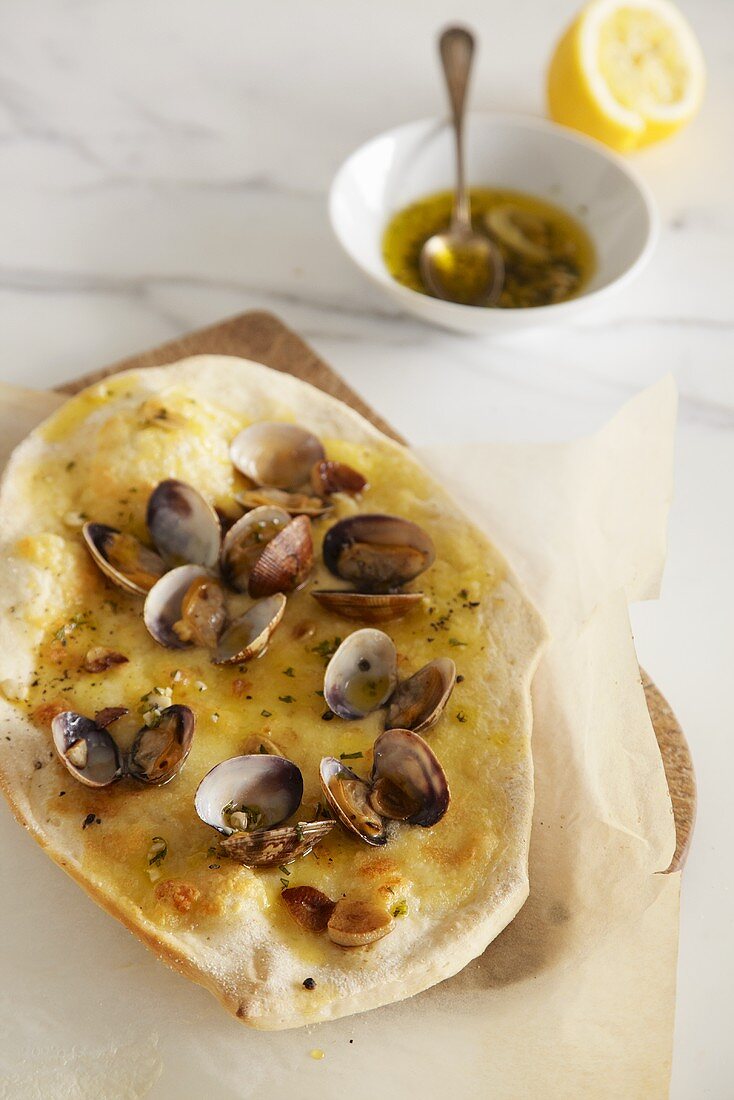 Pizza vongole with garlic and basil