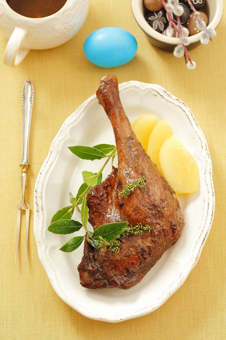Glazed goose leg with marinated pears for Easter