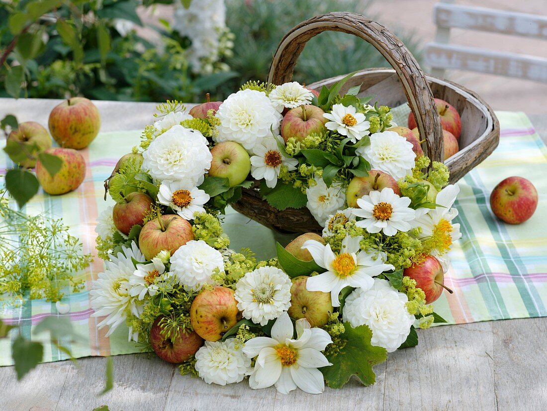 Late summer wreath of dahlias, apples, zinnias, fennel