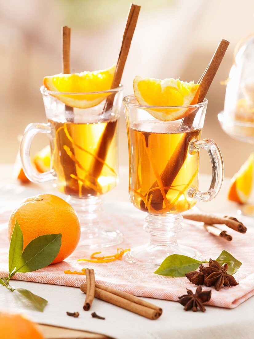 Orange tea punch with cinnamon sticks and star anise