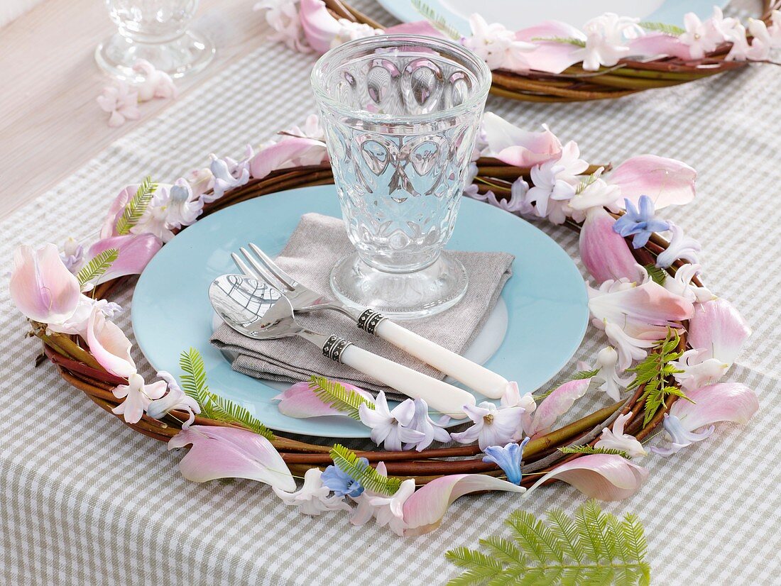 Willow wreath with garland of flowers and petals