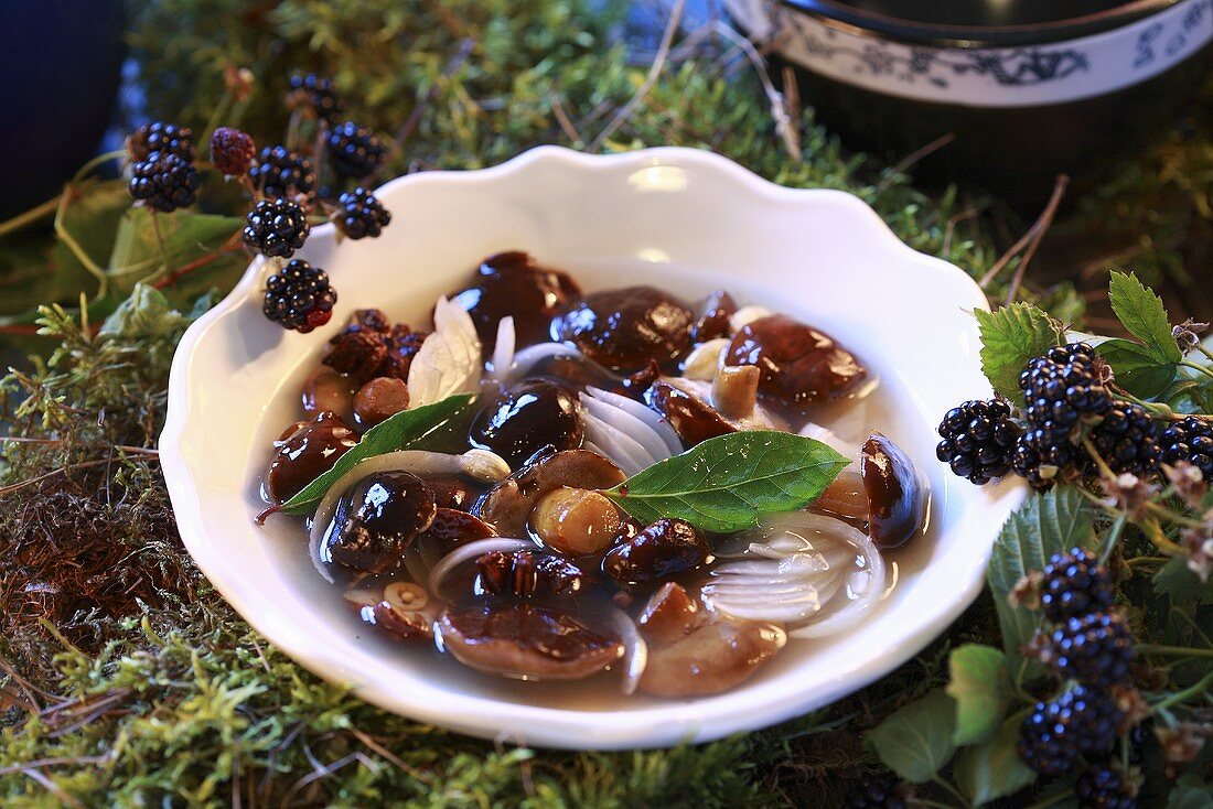 Marinated bay boletes with bay leaves and onions