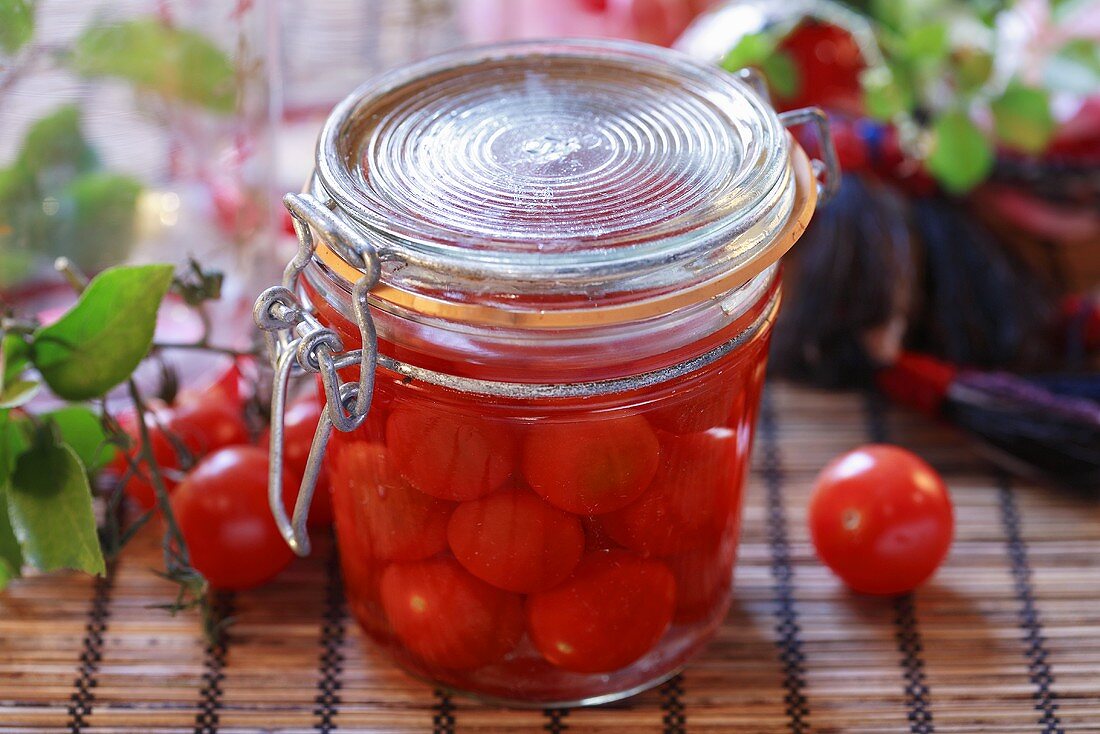 Bottled cherry tomatoes in preserving jar