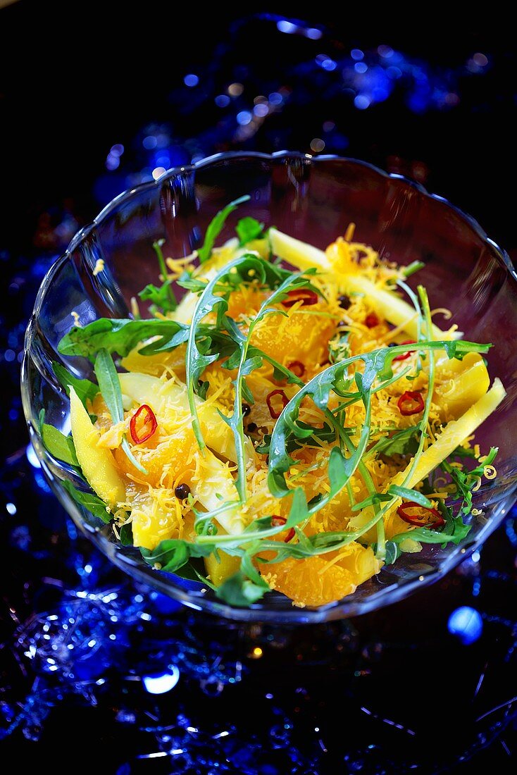 Cheese and orange salad with rocket and chilli