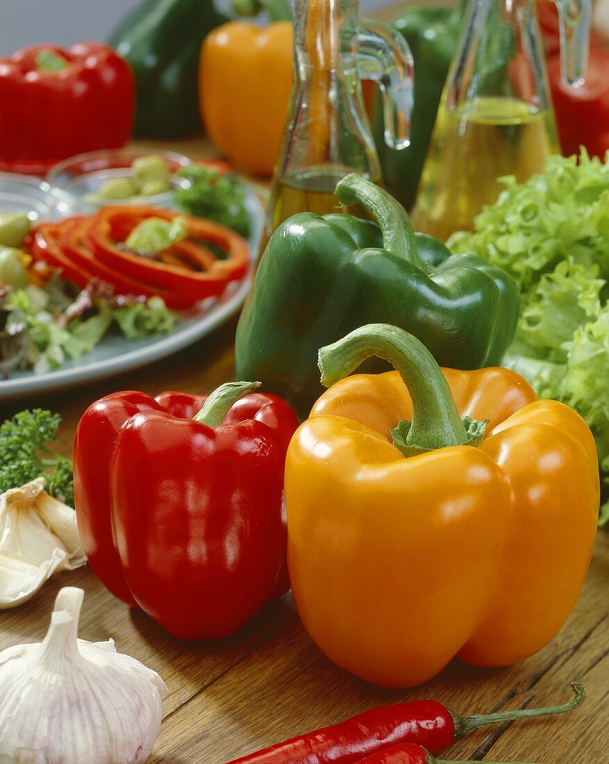 Assorted peppers on wooden background