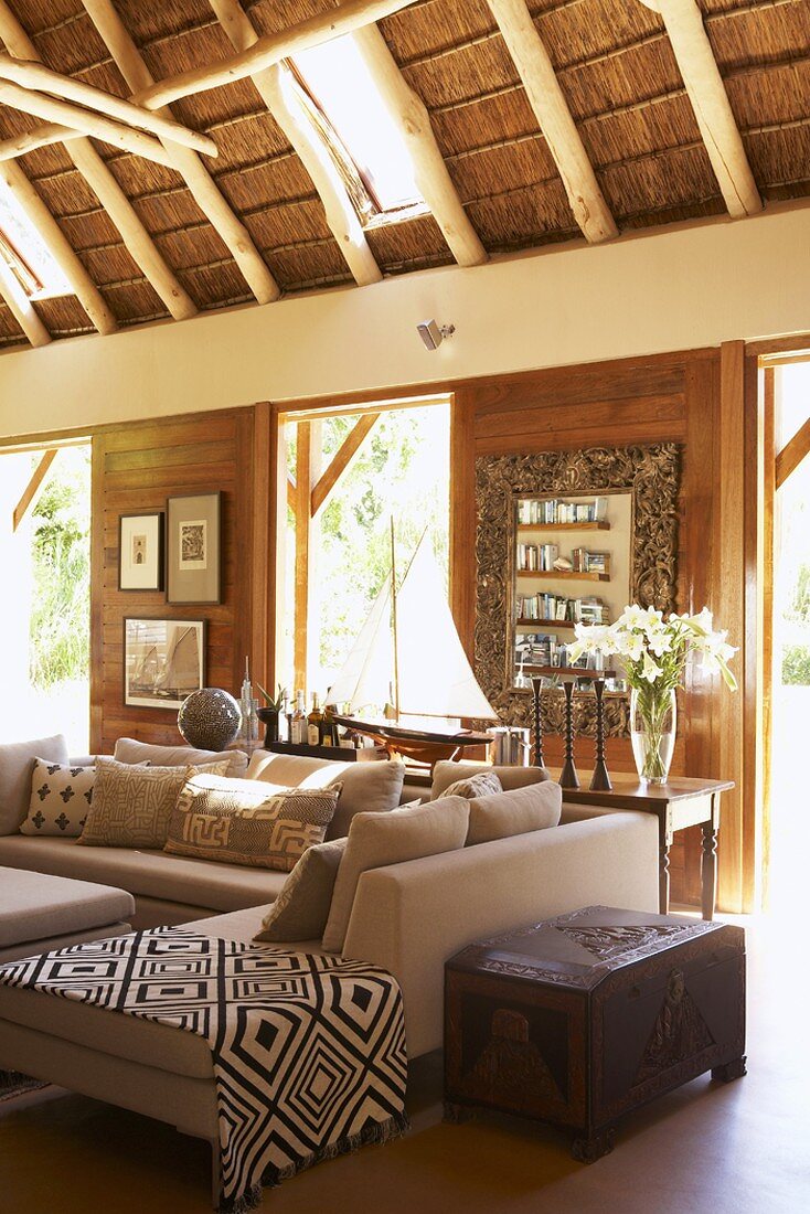 Interior of wooden house with high wooden ceiling and skylights