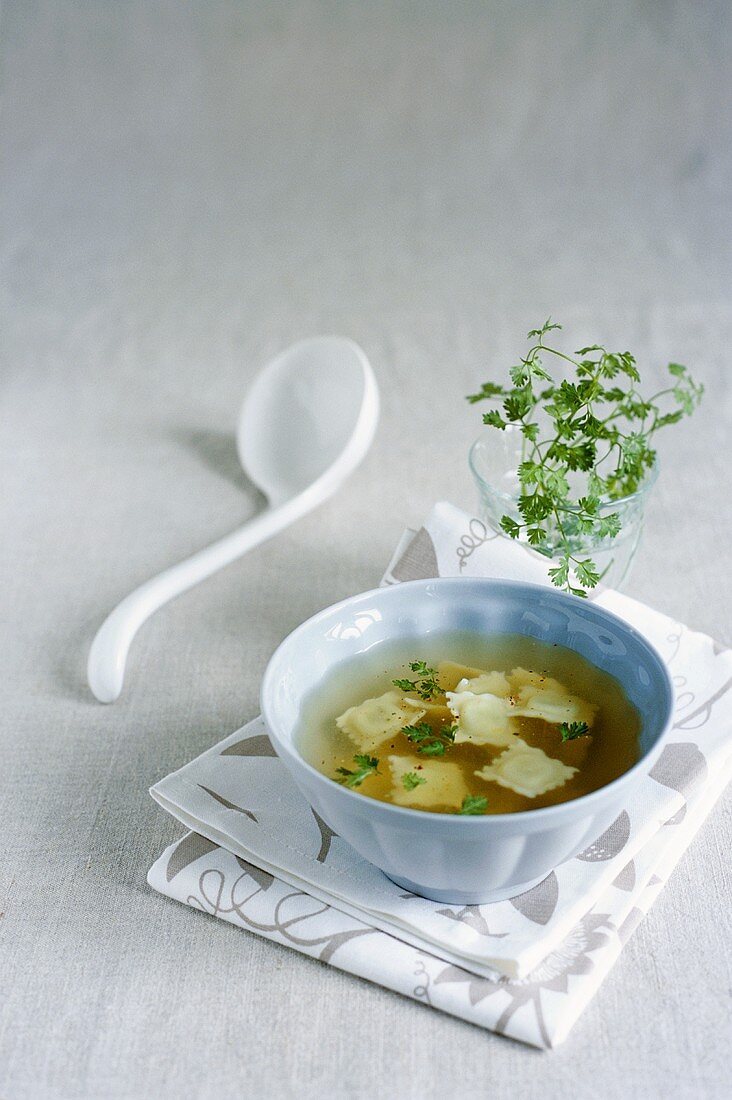 Herb soup with ravioli
