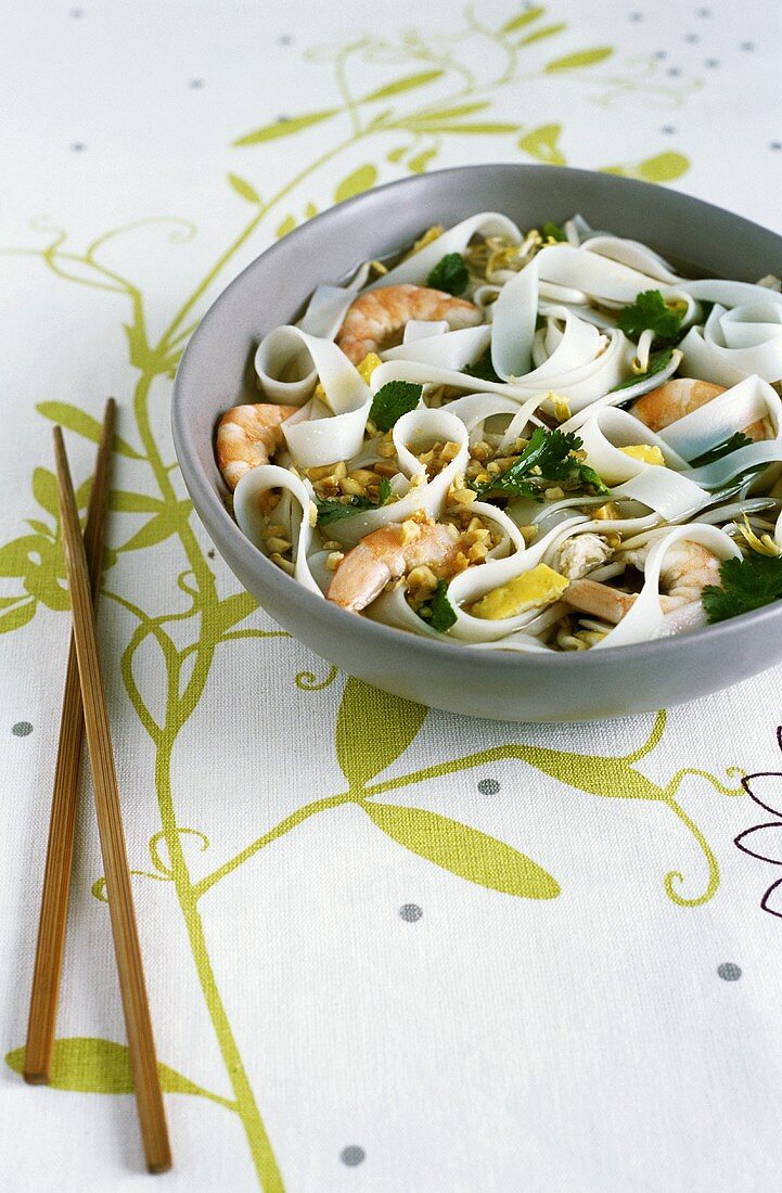 Chicken soup with prawns, peanuts and Asian ribbon noodles