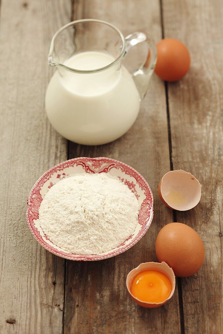 Ingredients for pancakes: flour, eggs and milk