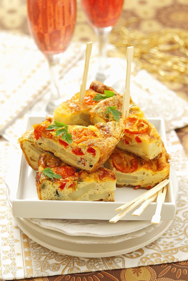 Potato tortilla with peppers and tomatoes