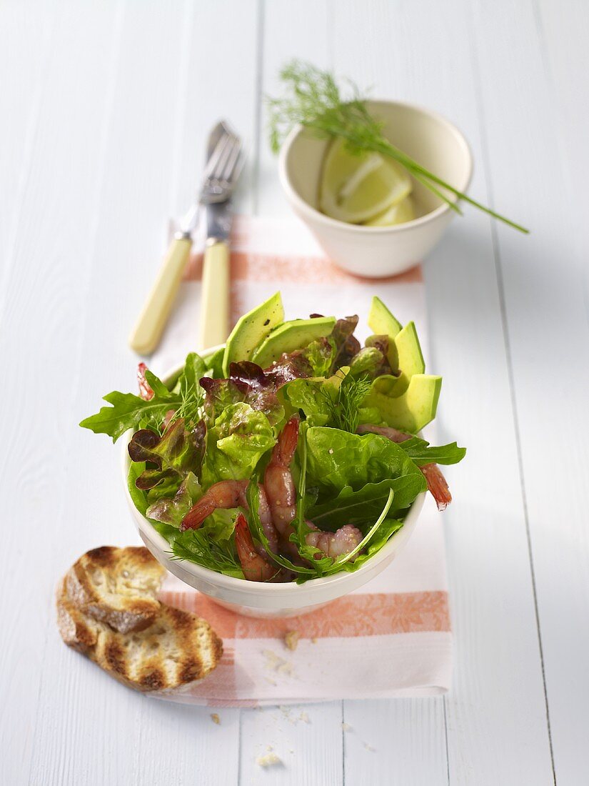 Mixed salad with avocado and prawns