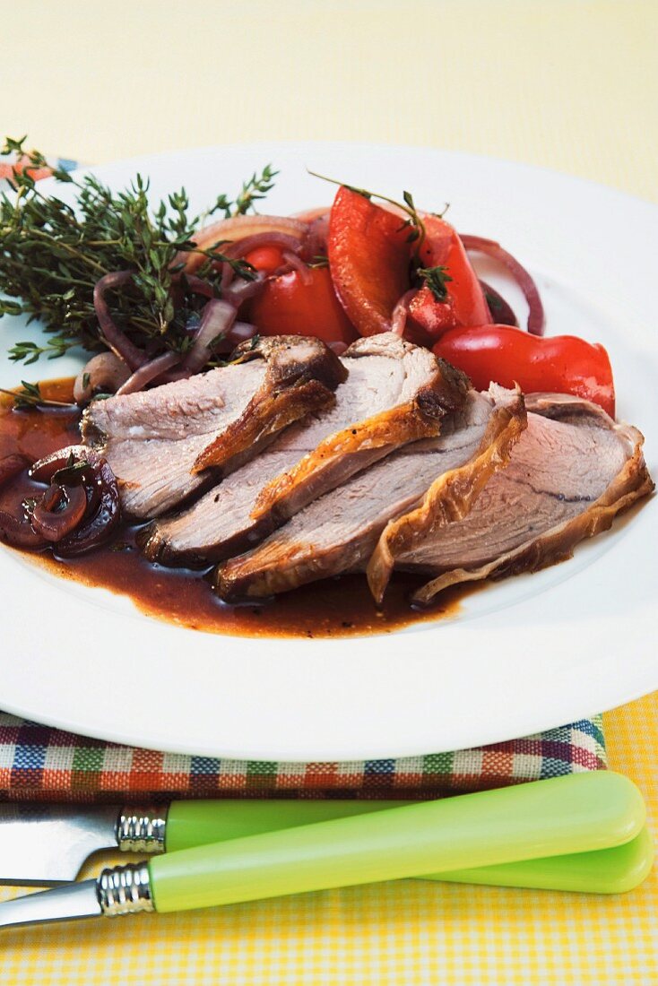 Roast lamb with onions and peppers
