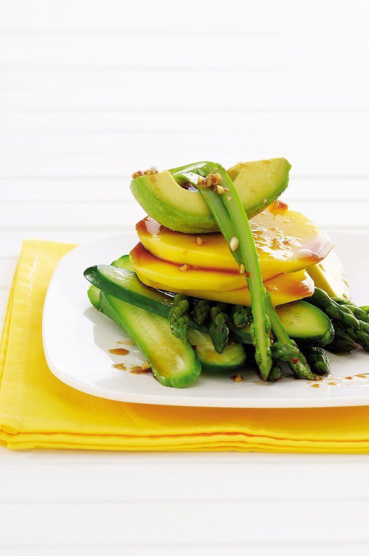 Cucumber, mango, avocado and asparagus salad with Asian dressing