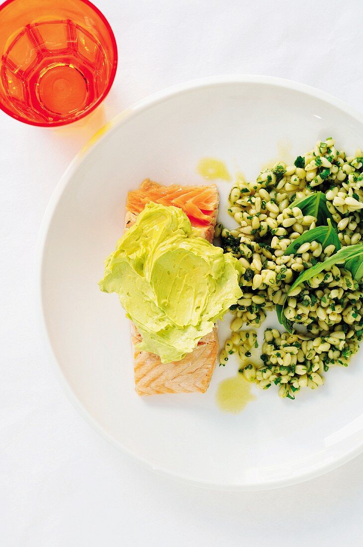 Grilled salmon fillet with avocado and herb orzo