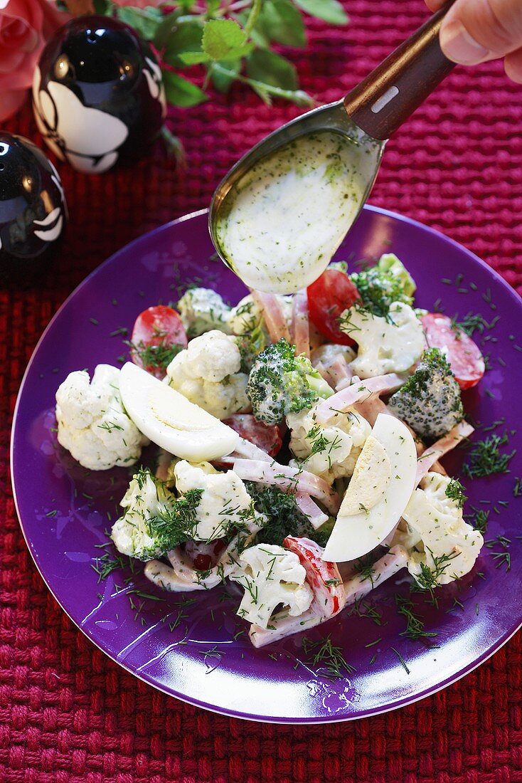 Cauliflower, broccoli and egg salad with herb dressing