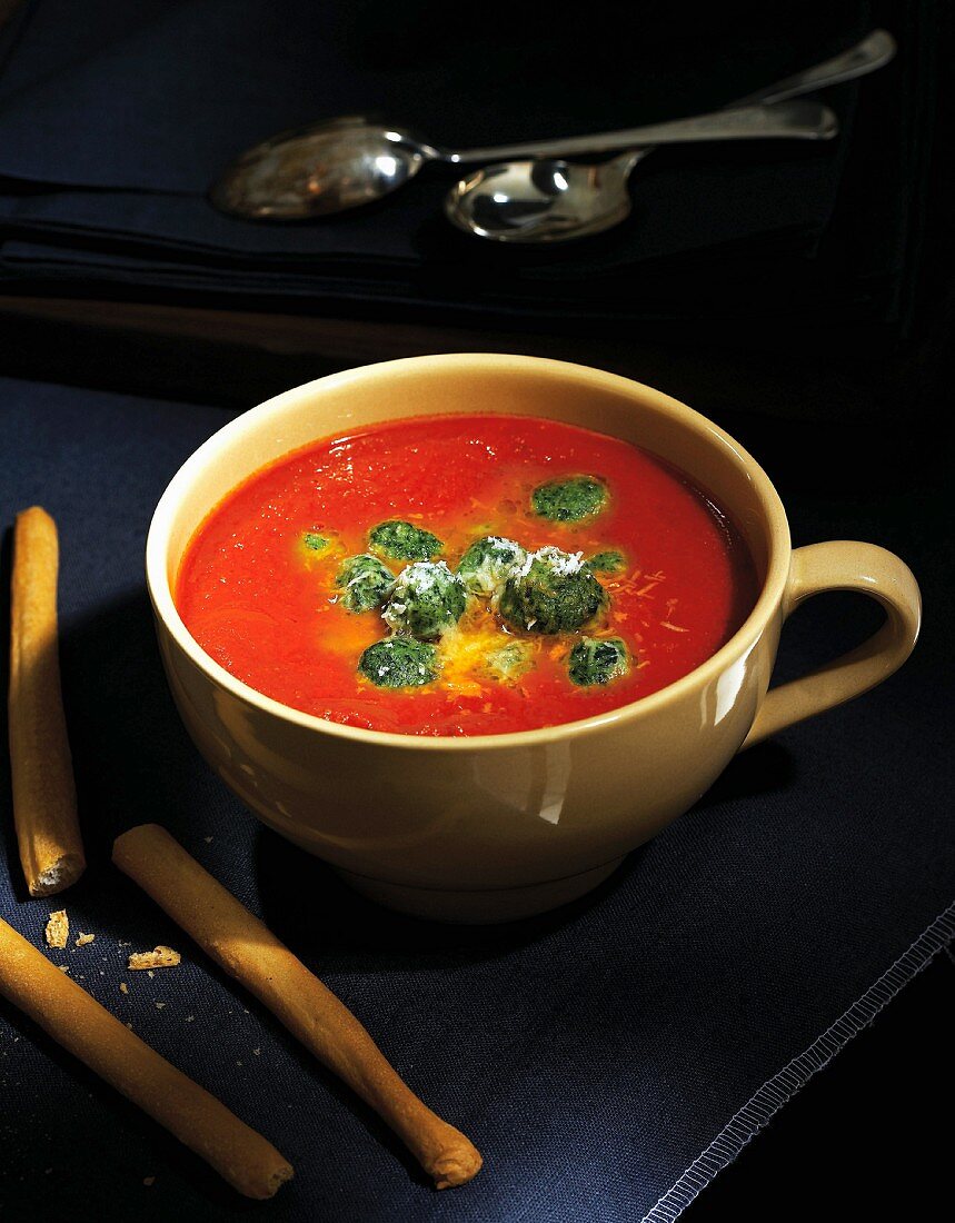 Wintry tomato soup with spinach dumplings and Parmesan