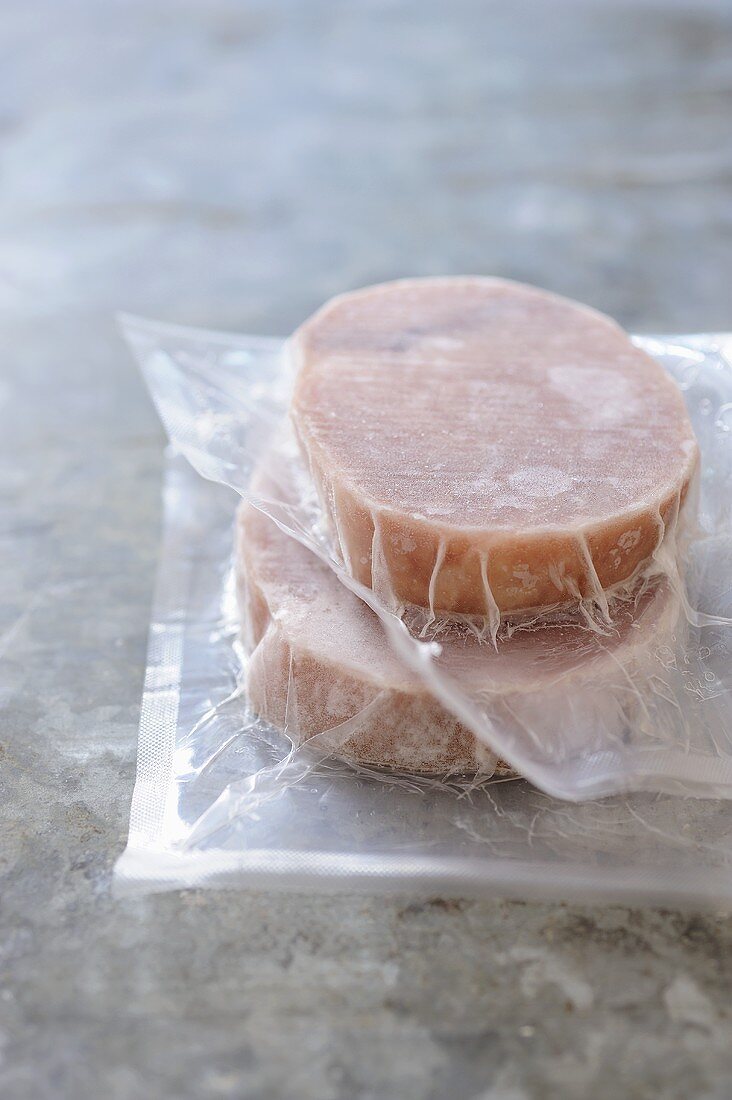 Frozen tuna fillets in plastic packaging