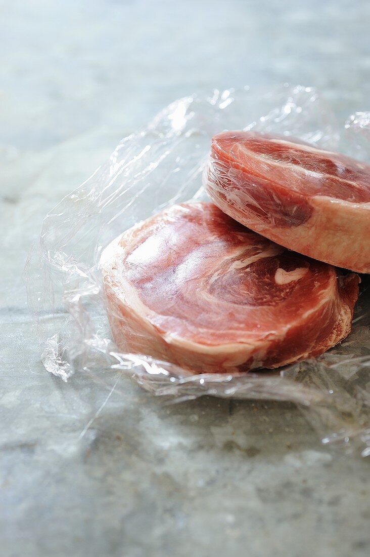 Frozen lamb on clingfilm