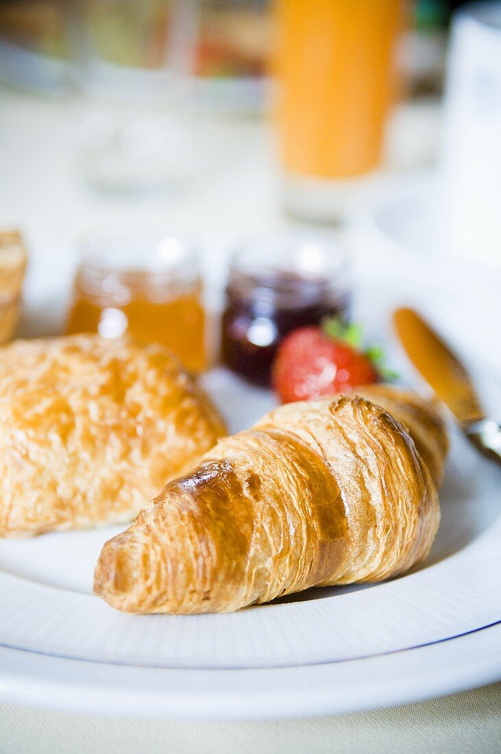 Croissant and jam for breakfast (France)