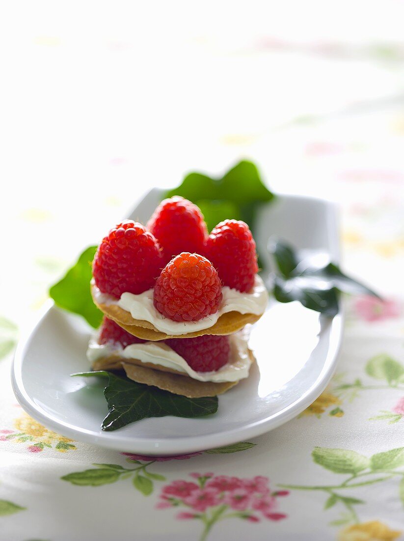 Layered fancy with raspberries and cream
