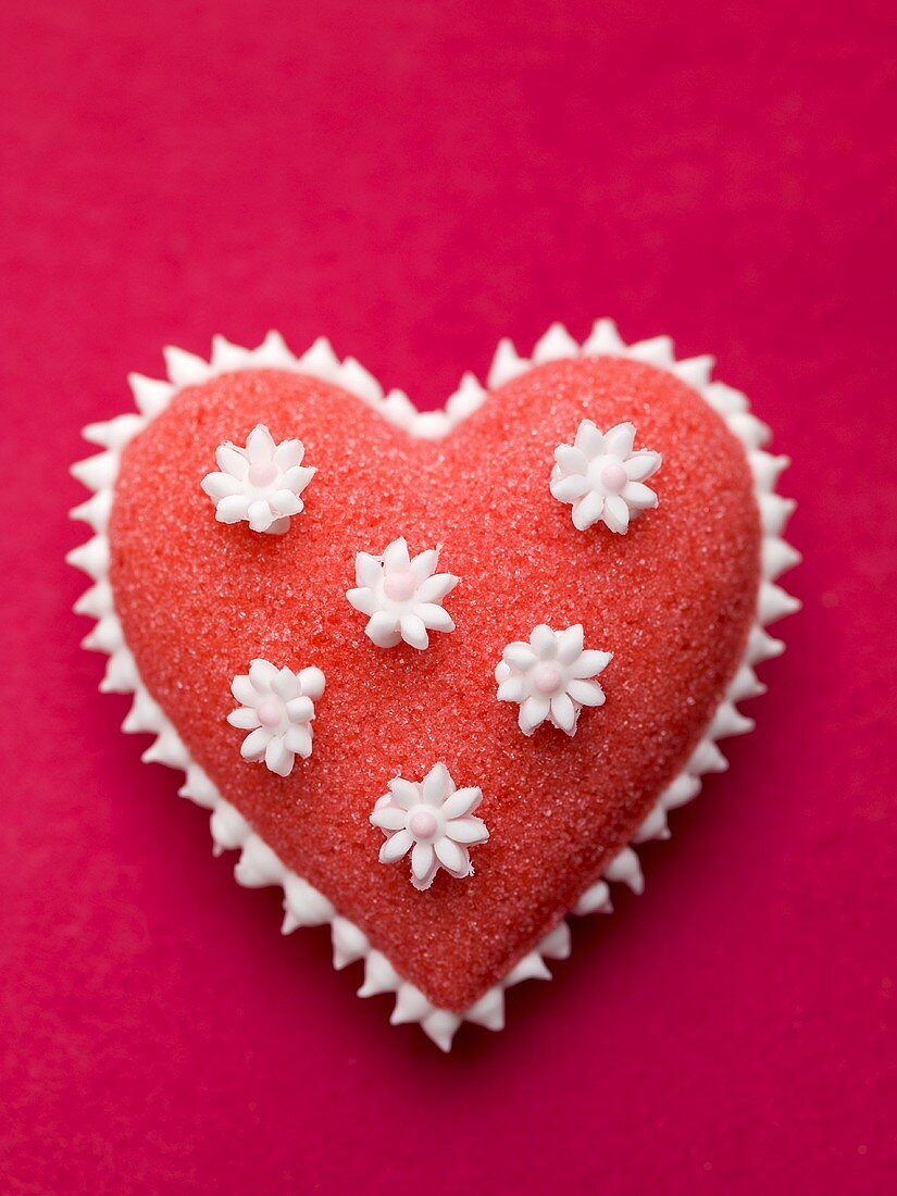 Red sugar heart with white flowers