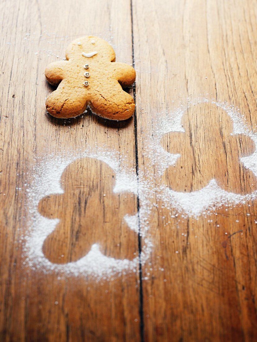 Gingerbread man on wooden board