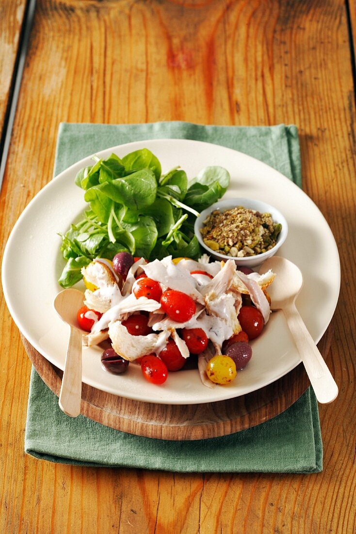Chicken salad with cherry tomatoes and olives