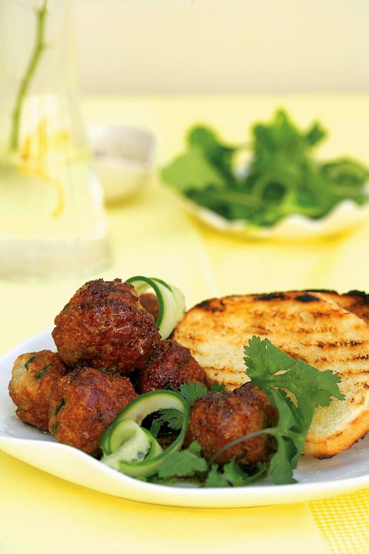 Chicken meatballs and toasted bread